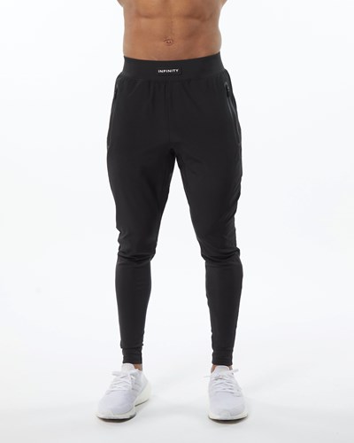 Alphalete Woven 4-Way Stretch 29" Pant Blackout | 82403-UGBV